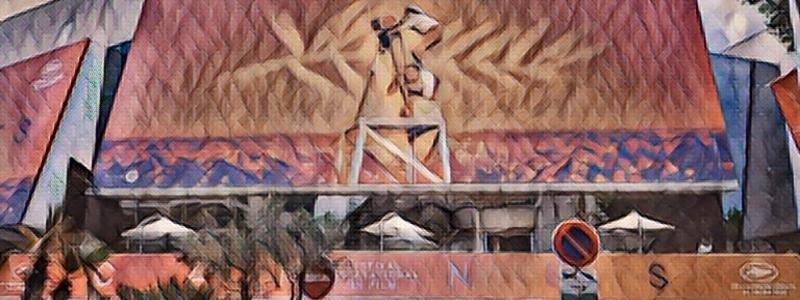 This picture shows a building with a large flag in the foreground. The building has a light-colored brick facade and several windows. In the foreground is a large flag that is being flown from atop a tall pole. The colors of the flag are red, white, and blue, and it has several stars on it. The sky in the background is a bright blue with a few white clouds. The building and the flag create a patriotic scene that is sure to inspire. The colors of the building and the flag are vivid and create an eye-catching scene. The flag is a symbol of freedom and the building is a symbol of strength. Together they create a powerful image.